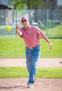 CEREMONIAL PITCH: Interim town manager Bill Crank threw the ceremonial pitch to officially announce the start of this year’s softball season on Wednesday, June 8 at Gothic Field. photo by Lydia Stern