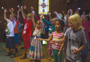 CAMP CONCERT:  Kids sang songs about Jesus at UCC during the culmination of an Oh Be Joyful Church summer camp.  photo by Lydia Stern